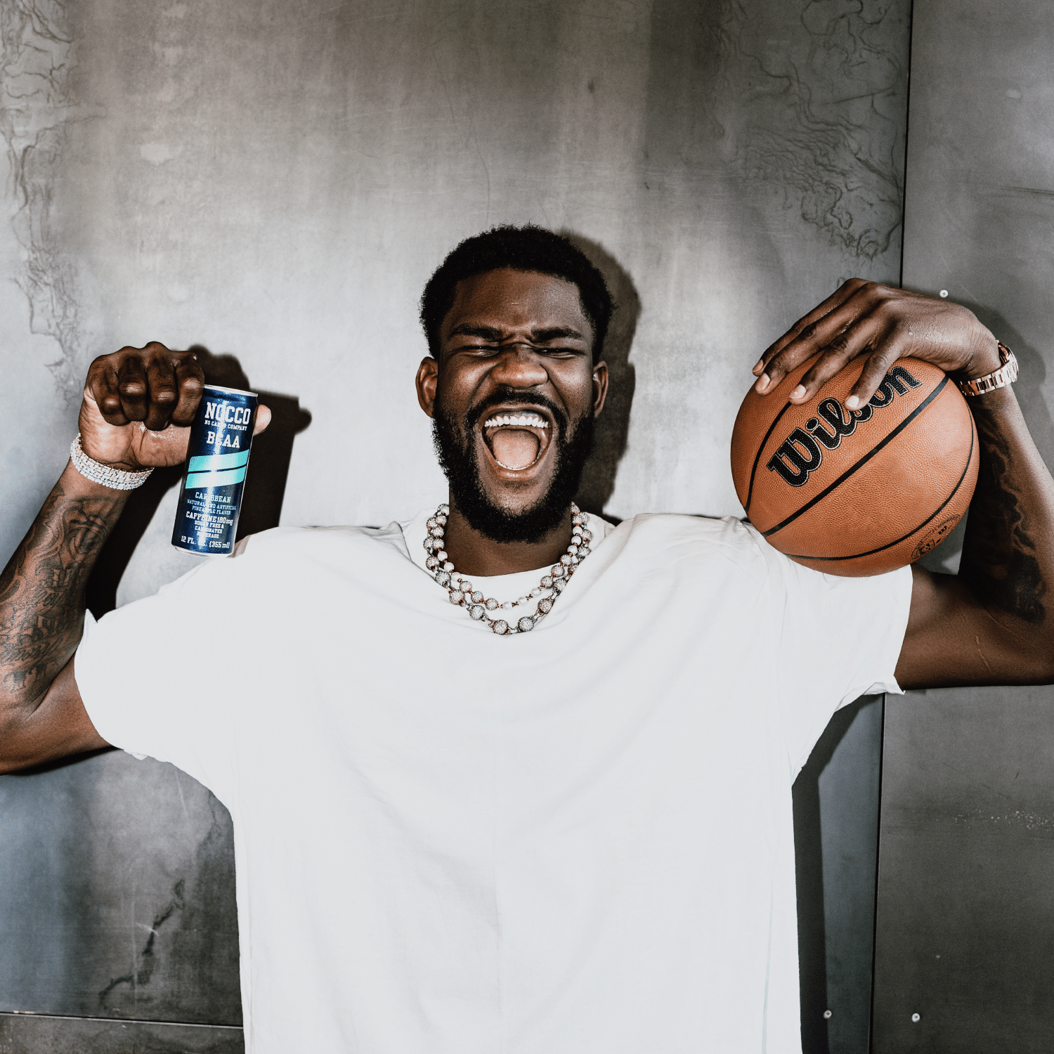 Deandre Ayton holding Nocco