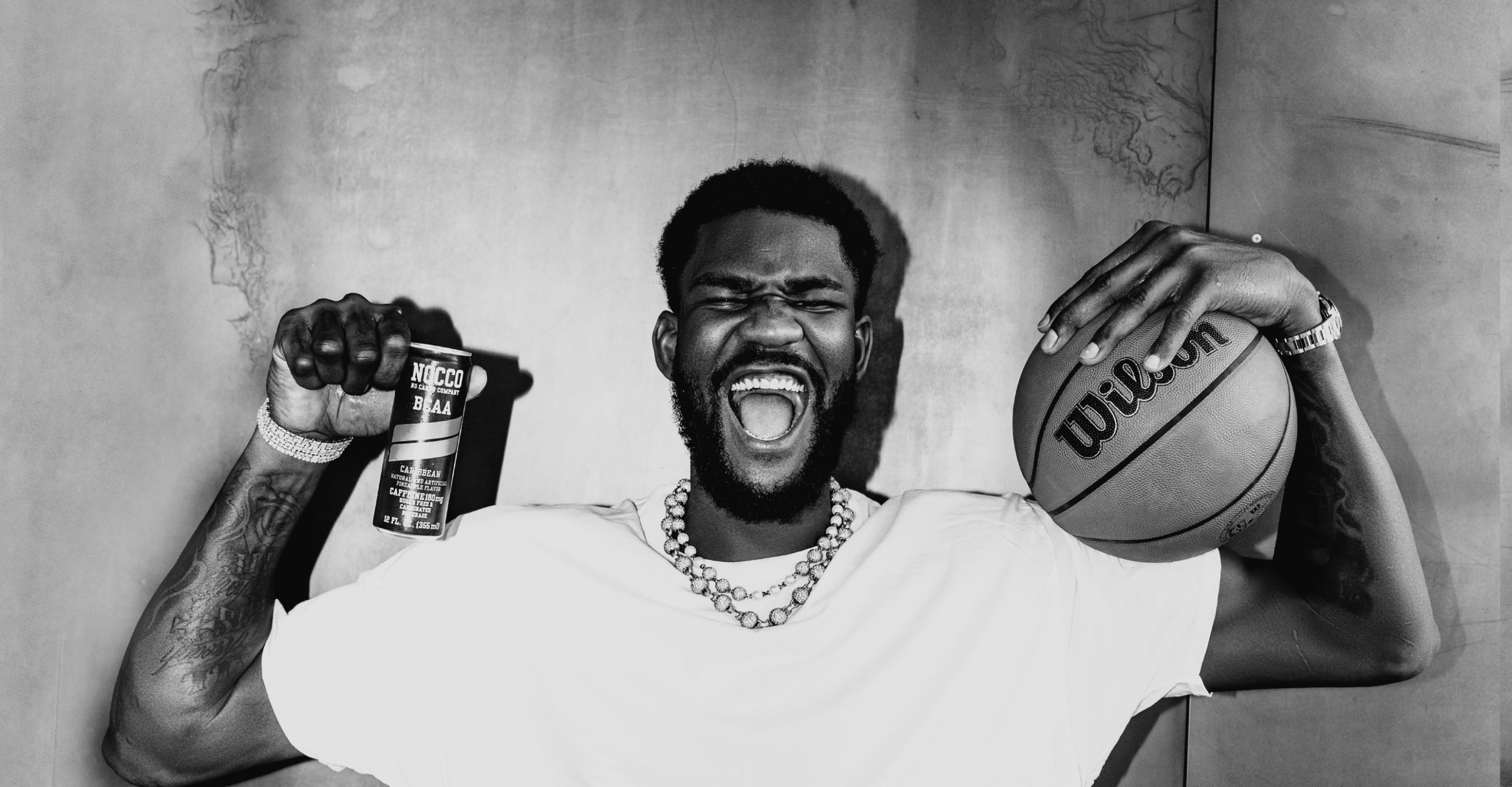 Deandre Ayton holds a can of Nocco